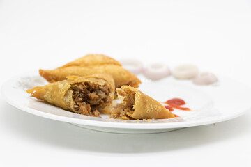 golden samosa isolated on white background