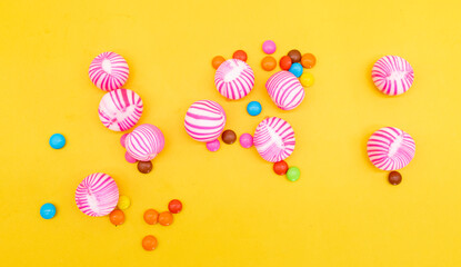 candies pieces isolated on yellow background