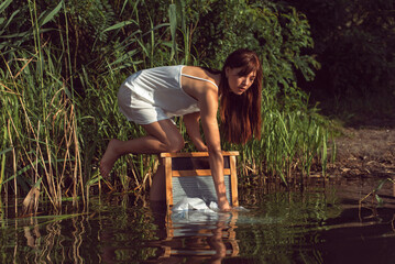 Fototapeta premium Young brunette woman on a sunny summer day