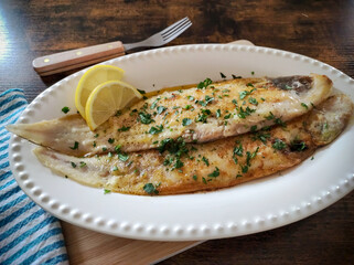 lemon baked fish in a dish