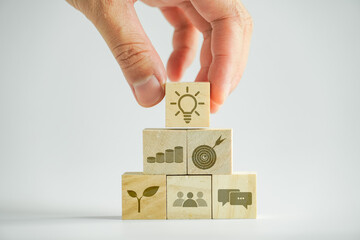 Concept knowledge sharing and management. Building wood blocks key to success, icon for idea on...