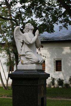 Moscow. Russia-August 25, 2021: Sculpture of a praying angel on the grave. Novodevichy Monastery. 