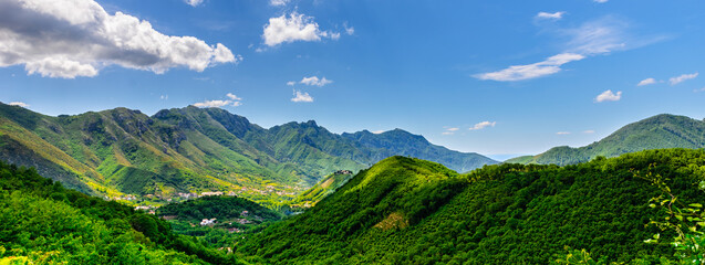 Fototapeta na wymiar Amalfi Coast, Italy. Green mountains. View on the enchanting hills of the Lattari Mountains close to the Amalfi Coast. Banner header horizontal.