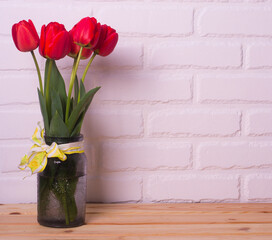 Spring flowers. Bouquet of red tulips in a vase on a white background.Valentine's day background, Mother's day background. copy space for text