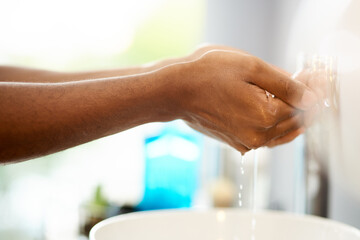 To maintain good hygiene wash hands often. Shot of an unrecognizable person rinsing their hands in a sink.