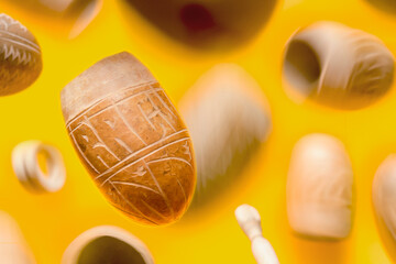 Nicaraguan culture and gastronomy. Gourd wood jugs floating in a yellow space. The container is...