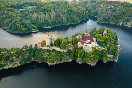 Panoramic view of Zvikov Castle on the hill with trees surrounded by river Vltava and Otava in South Bohemia region in Czech Republic. Pine or spruce forest on the background 