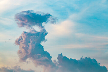 Strange cloud on the blue sky at sunset or evening time.