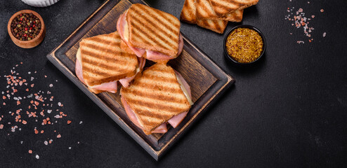 Delicious fresh toast grill with cheese and ham. Sandwiches, quick snack