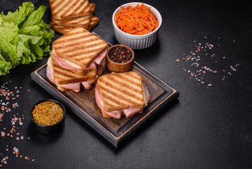 Delicious fresh toast grill with cheese and ham. Sandwiches, quick snack