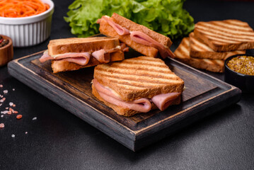 Delicious fresh toast grill with cheese and ham. Sandwiches, quick snack