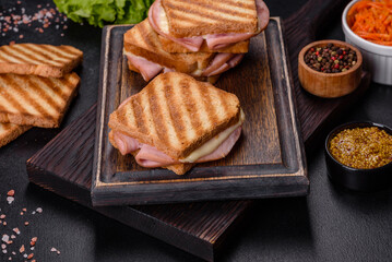 Delicious fresh toast grill with cheese and ham. Sandwiches, quick snack