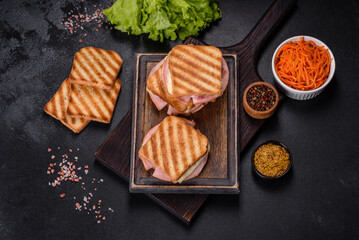 Delicious fresh toast grill with cheese and ham. Sandwiches, quick snack