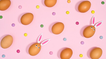 Creative Easter pattern with natural creative eggs on pastel pink background. Flat lay spring concept