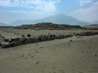 Fototapeta na wymiar Deserted roads to the sacred city of Caral, the oldest civilization in America in Barranca - Peru.