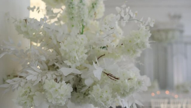large white bouquet of flowers at the wedding ceremony