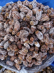 Dried persimmons on a farmers market stall in Yalikavak, Bodrum, Turkey.        