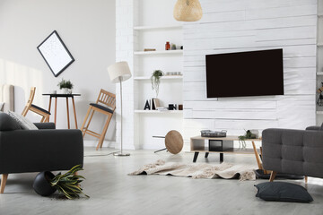 Chaotic living room interior after strong earthquake