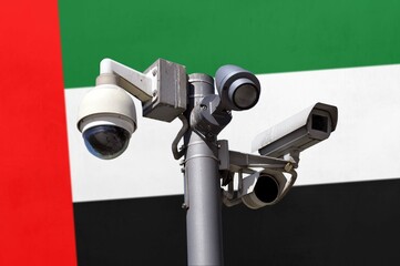 Closed circuit camera Multi-angle CCTV system against the background of the national flag of United Arab Emirates.