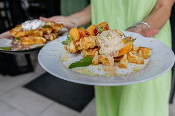Waffles breakfast with fruit and vegetables omelet camembert