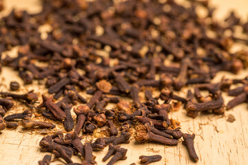 Close up of cloves on a wooden background