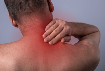 Neck pain concept. Injury and spasm in nape. Red point of ache. High quality photo