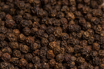 Black Pepper on a wooden background