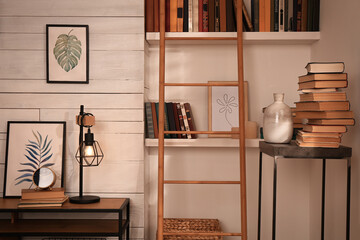 Home library interior with modern furniture and collection of different books on shelves