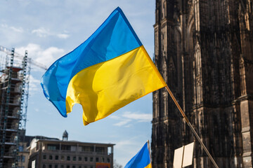 flags and symbols at a peaceful protest in defense of Ukraine