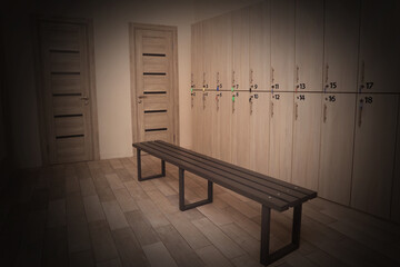 Wooden bench and lockers in changing room interior. Vignette effect