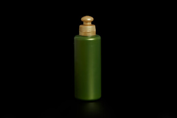 Can of unbranded combing cream on black background.