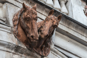 Fototapeta na wymiar Lviv, Ukraine - February, 2022: VUL. PEKARSKA, 19, high relief of horses at the entrance to BOARDING SCHOOL FOR CHILDREN WITH SPECIAL NEEDS (FORMER SIEMIEŃSKI-LEWICKI PALACE).