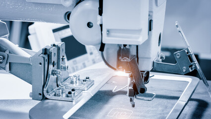 Sewing equipment, loom equipment at a garment factory, industrial concept background