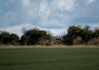 British army Supacat Jackal 4x4 rapid assault, fire support and reconnaissance vehicle in action on a military battle training exercise