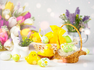Bright Easter card with colorful eggs, funny chickens, flowers and other elements. Bright colorful festive background.