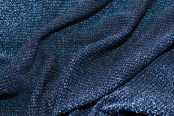 Texture of shiny sparkling lurex fabric blue color.