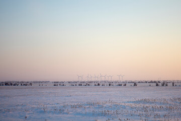 Wind turbines along the road are wind energy.