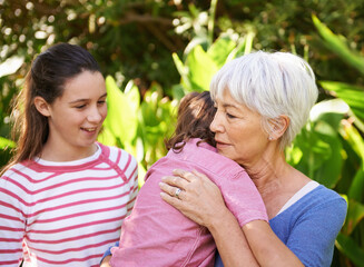 She loves her grandchildren. Shot of a mature woman with her grandchildren.