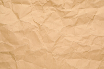 Texture of brown crumpled paper as background, closeup