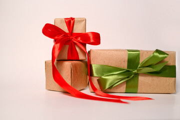 Eco-friendly composition with reusable gift boxes made of kraft paper and ribbon decor. Eco-friendly gift packaging.