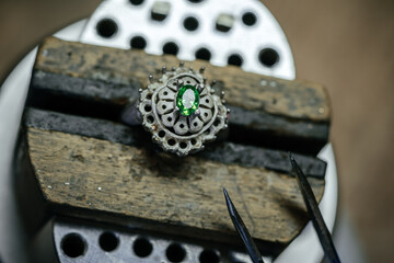Craft jewelery making with professional tools. Ring repairing. Putting the diamond on the ring....