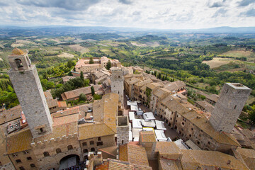 Spectacular view over the roofs of San Gimignano in Italy and the famous towers - obrazy, fototapety, plakaty