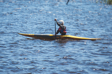 Kids learn kayaking, canoeing whitewater training in the lake river, children practicing paddling, yound kayakers in summer camp