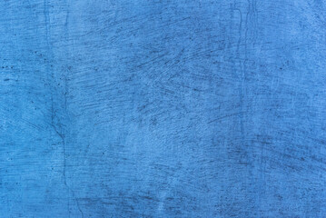 Photo of an old concrete wall tinted blue to use as a background