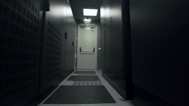 Symmetrically telecommunication racks in a sealed corridor. IT industry, technology concept.