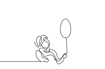 boy holding a balloon looking up