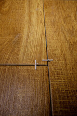 Laying ceramic tiles with the help of crosses for a tile by during wall cladding