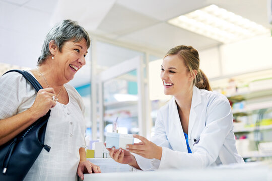 Dispensing the best treatment and advice. Shot of a young pharmacist assisting a customer.