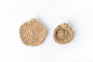 Natural washcloth made of craft thread for washing dishes. The concept of waste-free production , zero waste on white background isolated 