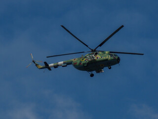 Naklejka na ściany i meble Ukrainian helicopter of border guards on a background of peaceful blue sky